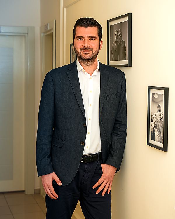 Op. Dr. Murat Alpay in the corridor of the practice